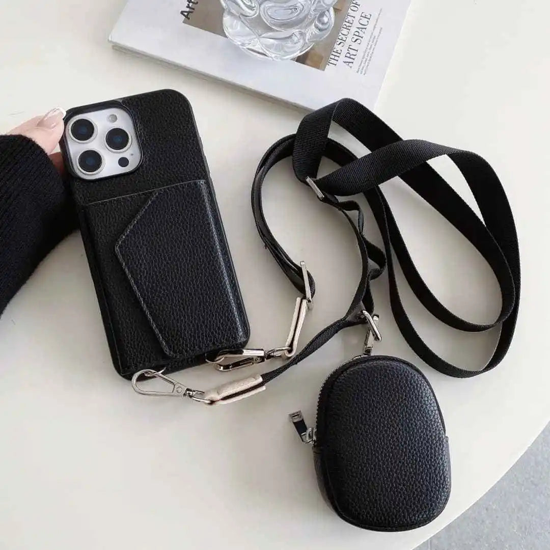 Black wallet phone case with card holder and detachable strap on a white surface