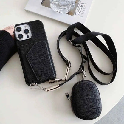 Black wallet phone case with card holder and detachable strap on a white surface
