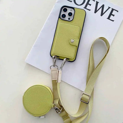 Green wallet phone case with strap on a white surface