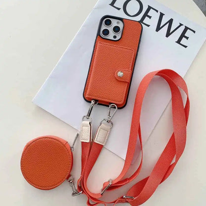 Orange wallet phone case with a strap on a LOEWE paper background