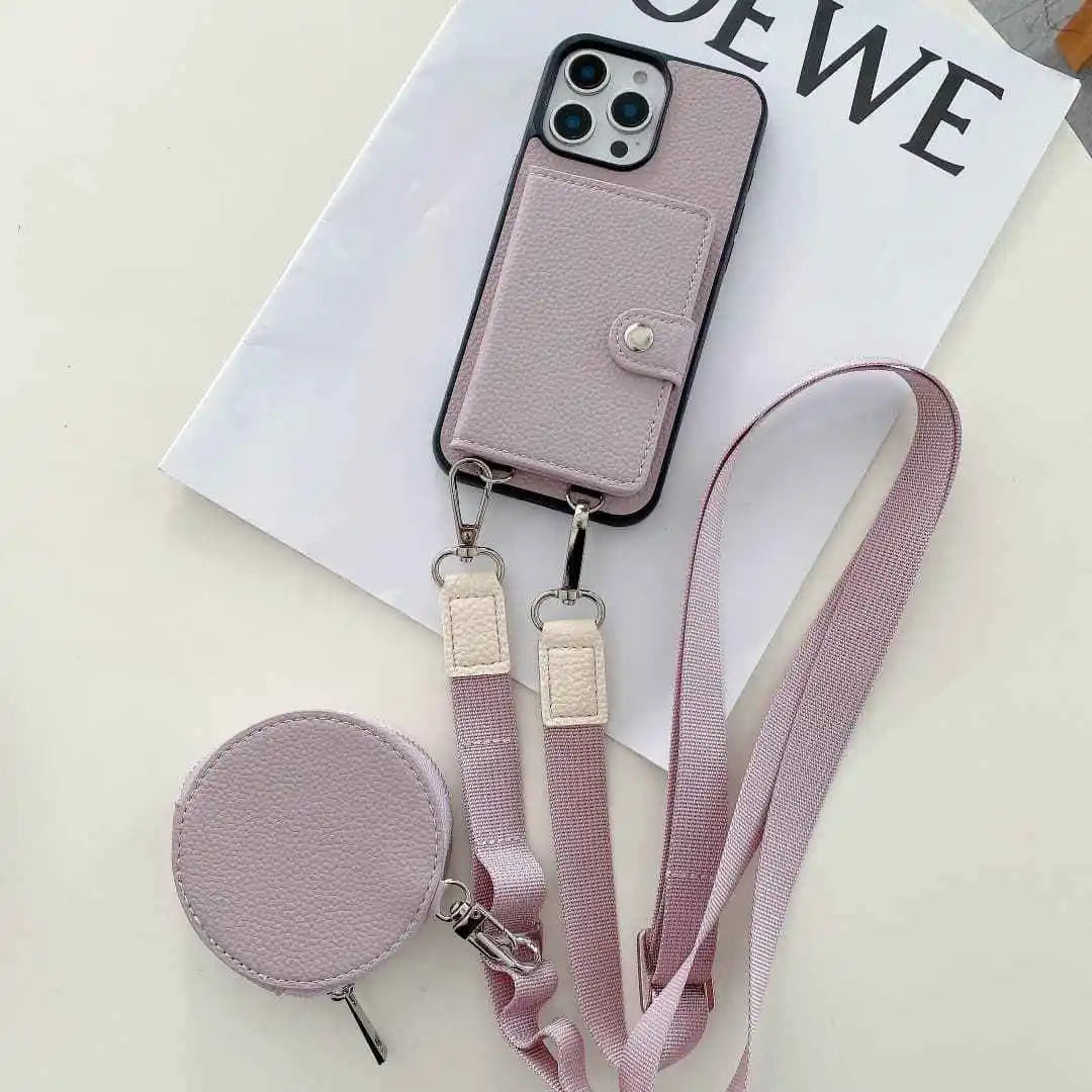 Pastel pink wallet phone case with detachable strap on a white surface