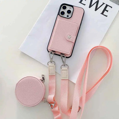 Pink wallet phone case with detachable strap on a white surface