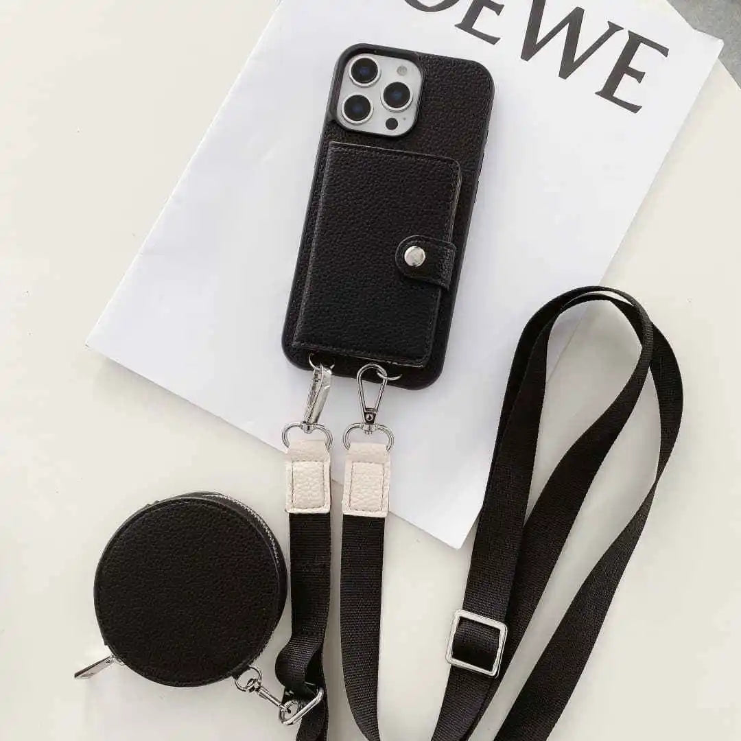 Black wallet phone case with lanyard and small round pouch on a white surface