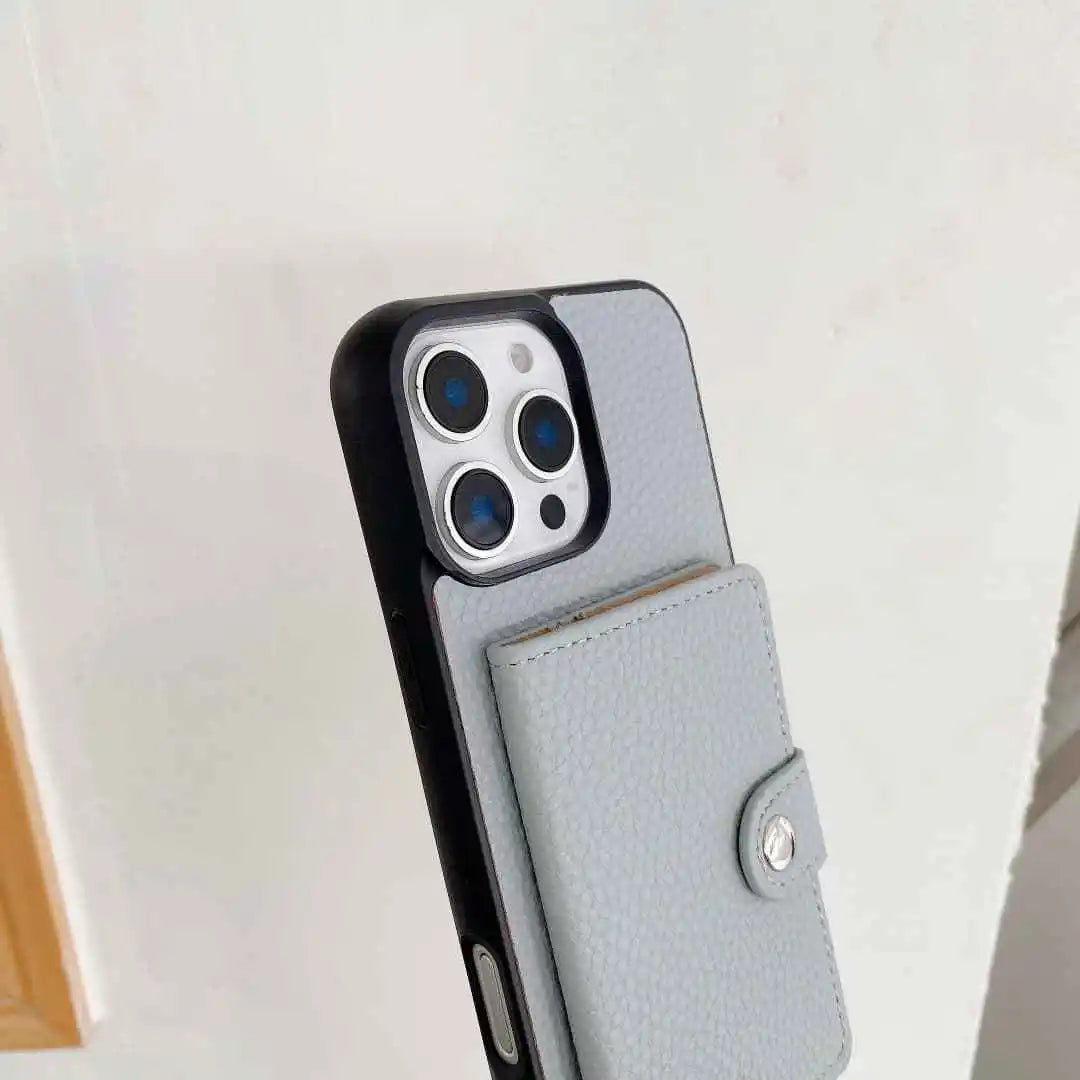 Phone case with a card holder attached to a smartphone on a light background