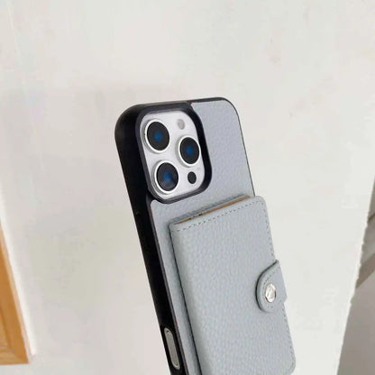 Phone case with a card holder attached to a smartphone on a light background
