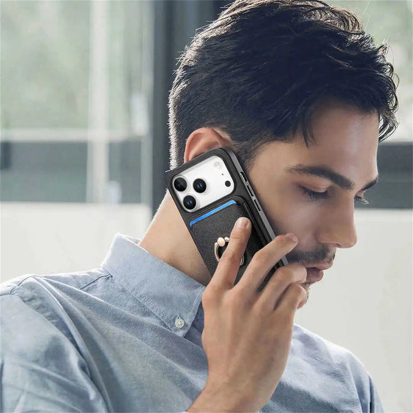 Man talking on a phone with a phone case featuring a magnetic card holder and ring