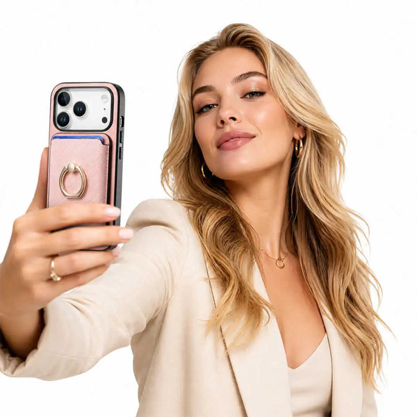 Woman holding a pink phone case with a wallet and ring holder on a white background