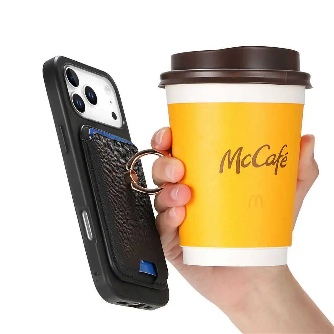 Hand holding a McDonald's McCafé cup and a phone case with magnetic wallet with cardholder.