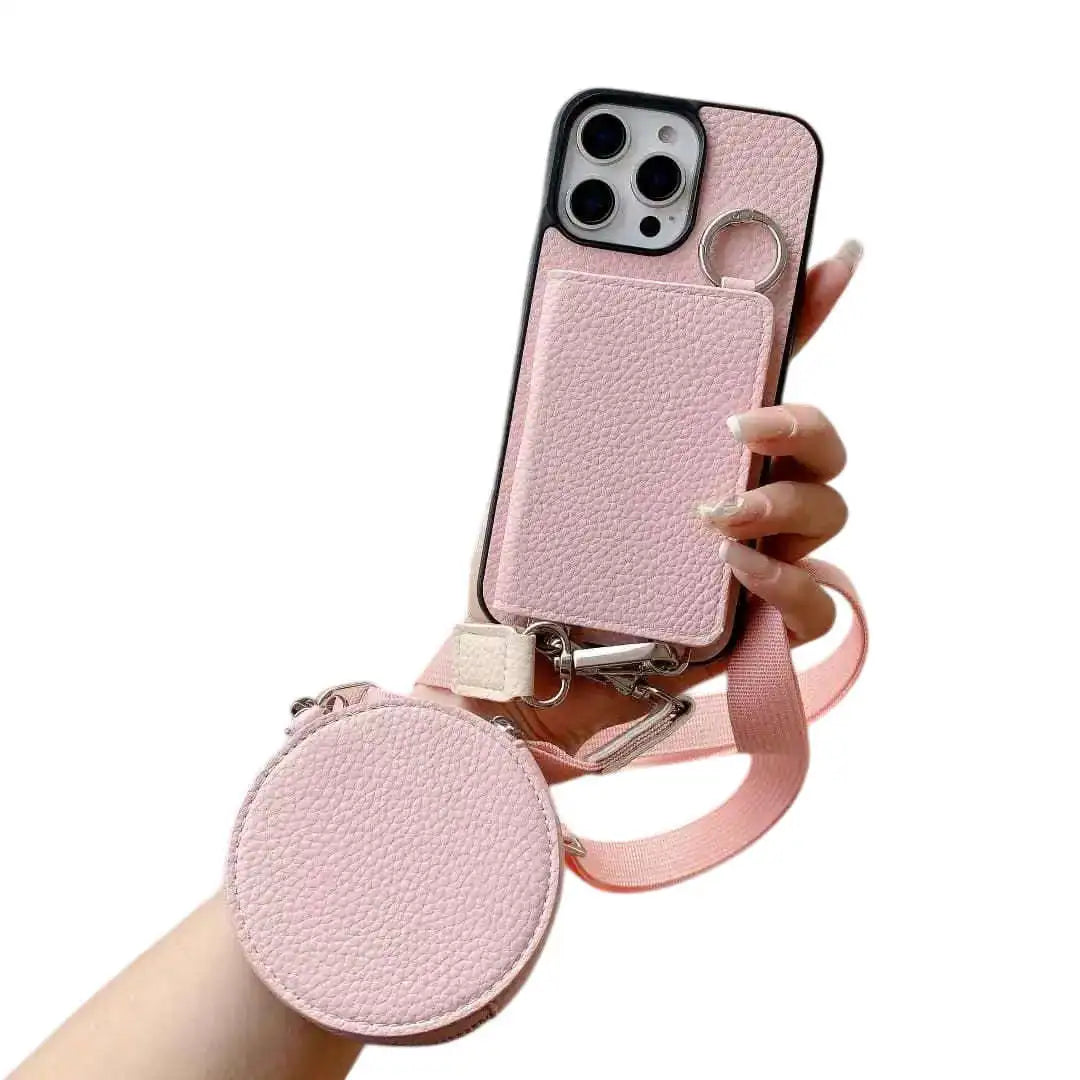 Pink wallet phone case with detachable strap held by a hand on a white background