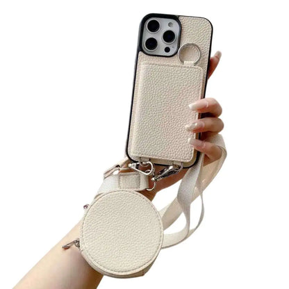 beige Phone case with detachable strap held by a hand on a white background