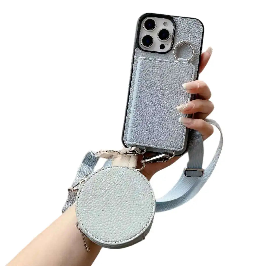 Dusty blue wallet Phone case with detachable strap held by a hand on a white background