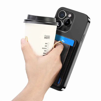 Hand holding a coffee cup and a phone featuring a card slot on a white background