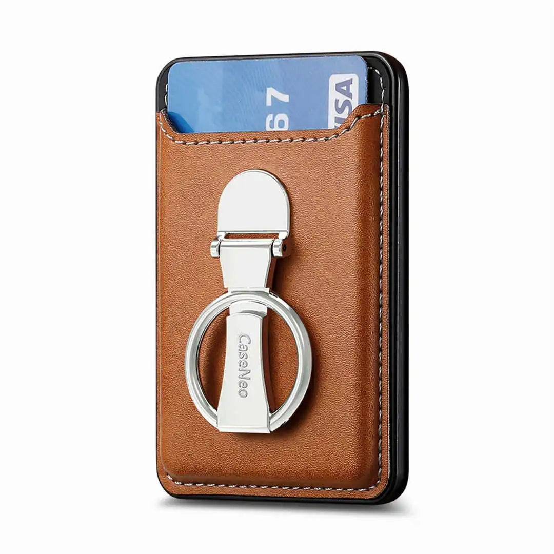 Brown leather cardholder with metal ring and card inside on a white background