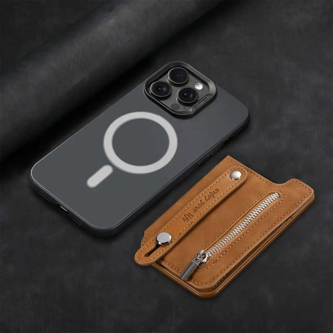 iPhone next to a brown leather wallet on a dark background