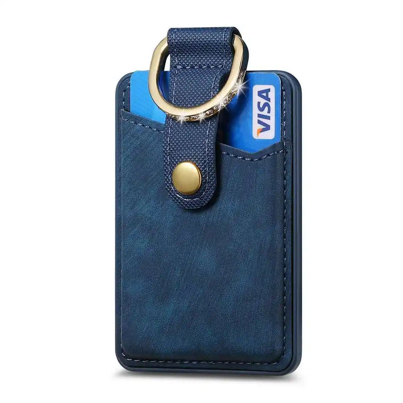 Navy cardholder with credit card and gold ring on a white background