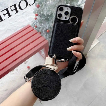 Black wallet phone case with a detachable strap held by a hand, with a blurred background.