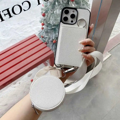 White wallet phone case with detachable strap held by a hand against a blurred indoor background