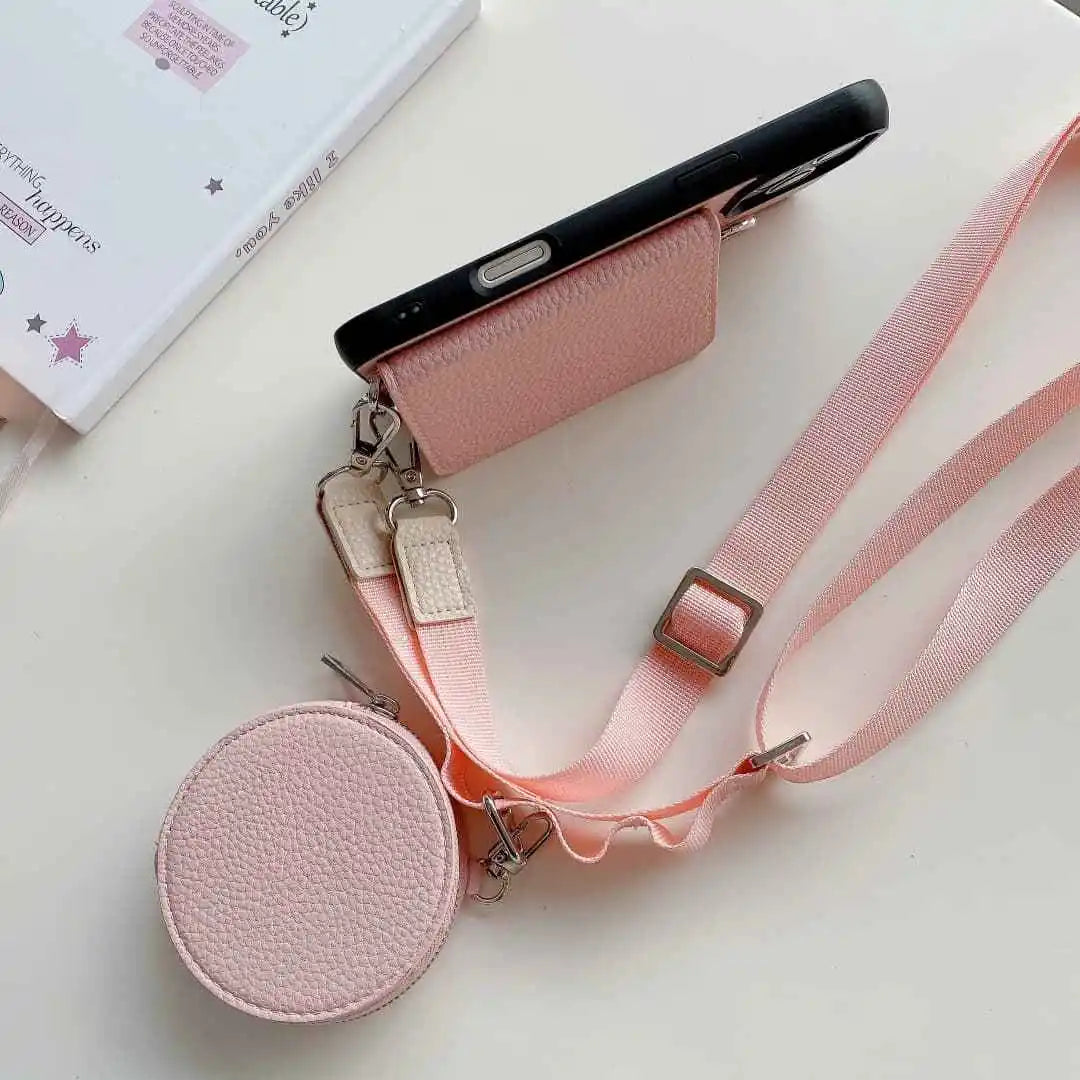 Pink wallet phone case with lanyard on a white surface