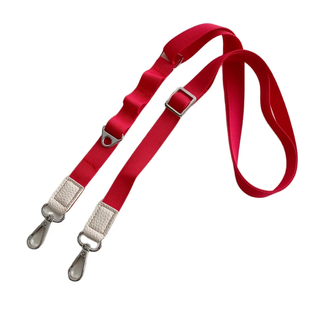 Red crossbody phone strap with silver hardware on a white background