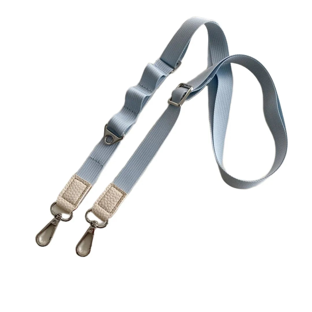 Light blue crossbody phone strap with beige clips on a white background