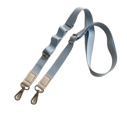 Light blue crossbody phone strap with beige clips on a white background