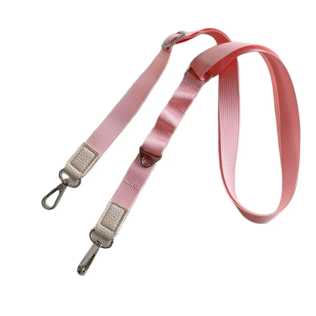 Pink  crossbody phone strap with metal clips on a white background