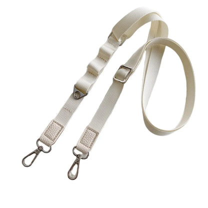 Beige  crossbody phone strap with metal hooks on a white background