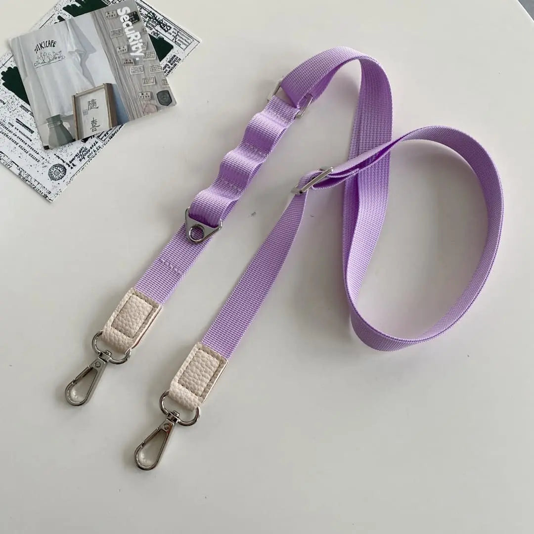 Purple phone strap with metal clasps on a light gray background