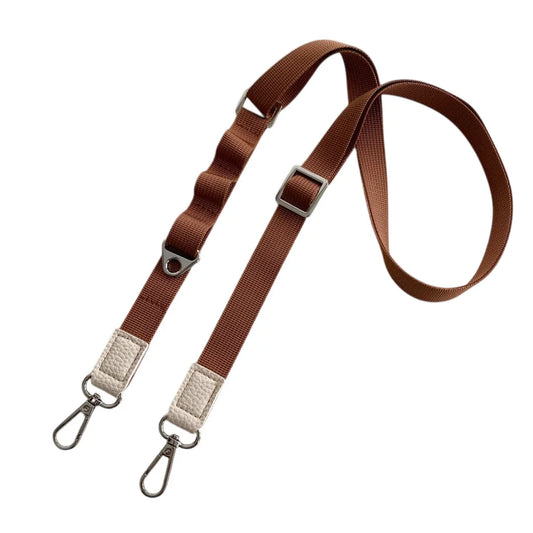Brown crossbody phone strap with metal clasps on a white background
